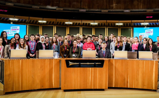 Team shot of large group of the young members of the Welsh Senedd voting for the first time