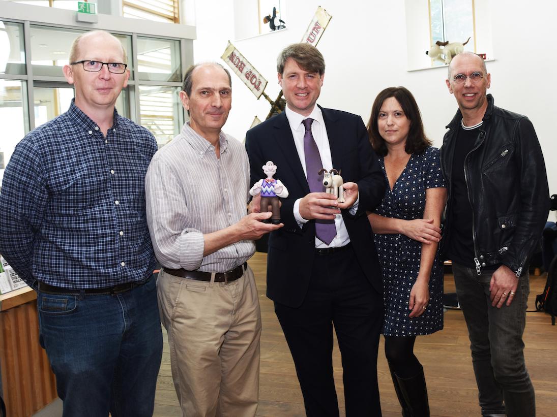 Jason Veal of Sugar Creative, David Sproxton of Aardman, Chris Skidmore MP , Minister for Business Energy and Industrial Strategy, Susan Cummings of Tiny Rebel Games, and Scott Ewings of Potato London, together with “lifesize” models of Wallace and Gromit, at Aardman in Bristol.